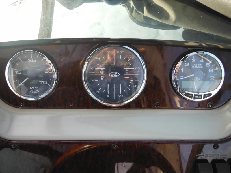 Slide: The Image of Dashboard of 2010 Sea Ray 260 Sundancer with speedometer and gauges. - 19