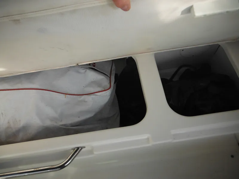 Slide: The Image of Storage compartment of 2010 Sea Ray 260 Sundancer boat, partially open. - 24