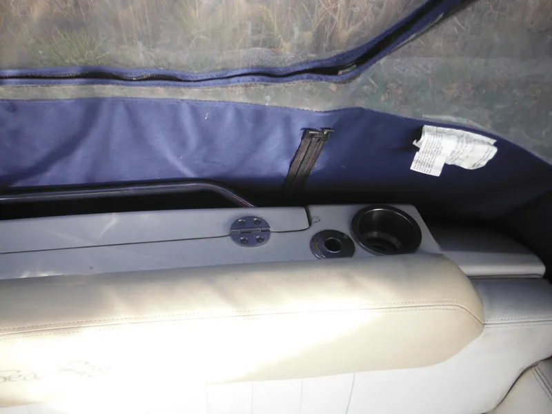 Slide: The Image of Interior view of 2010 Sea Ray 260 Sundancer with cup holders and seating. - 25