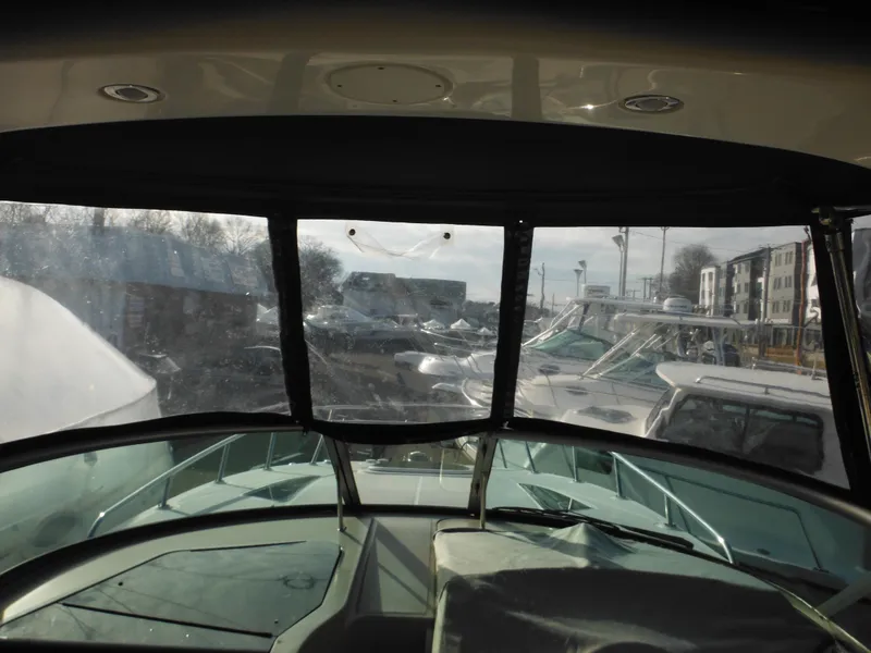 Slide: The Image of Interior view of 2010 Sea Ray 260 Sundancer boat docked at marina. - 29