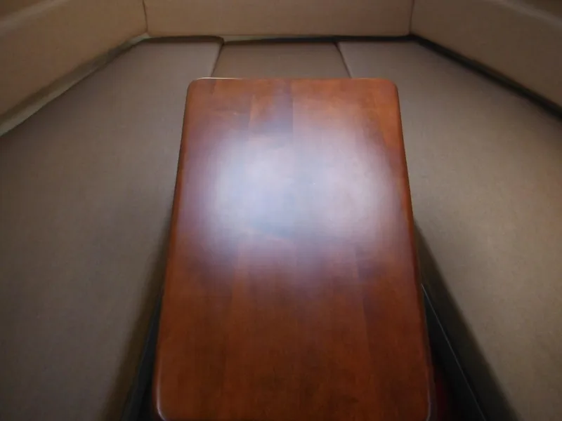 Slide: The Image of Interior cabin of 2010 Sea Ray 260 Sundancer with wooden table. - 37