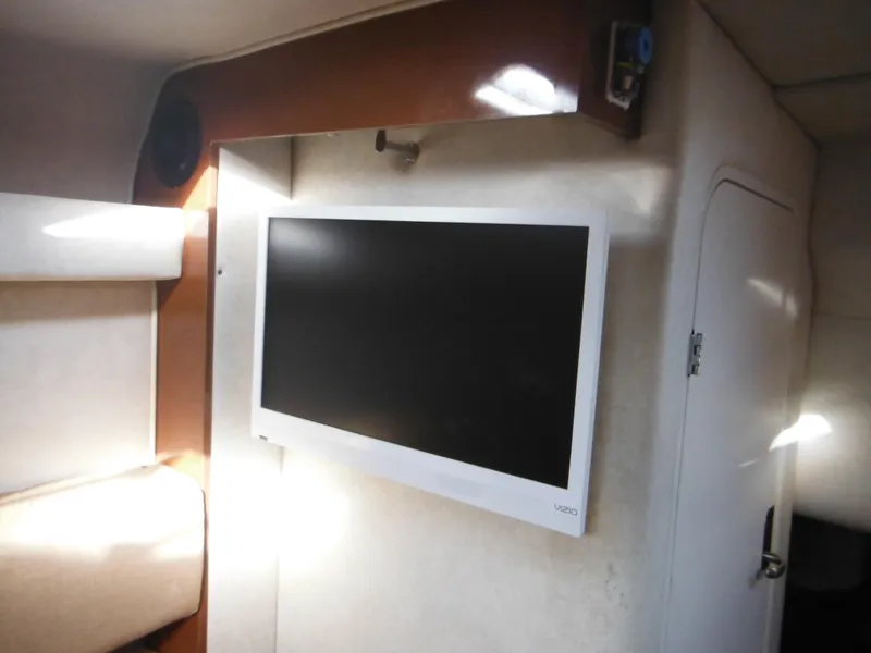 Slide: The Image of Interior of 2010 Sea Ray 260 Sundancer with wall-mounted flat-screen TV. - 38