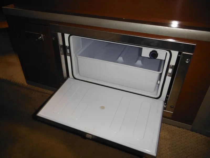 Slide: The Image of Open refrigerator in 2010 Sea Ray 260 Sundancer boat interior. - 40