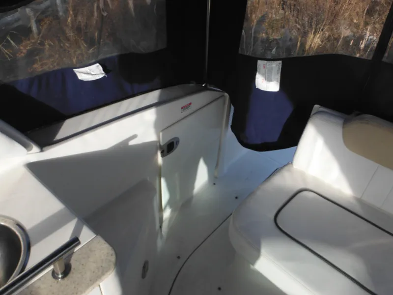 Slide: The Image of 2010 Sea Ray 260 Sundancer interior with seating and sink. - 8