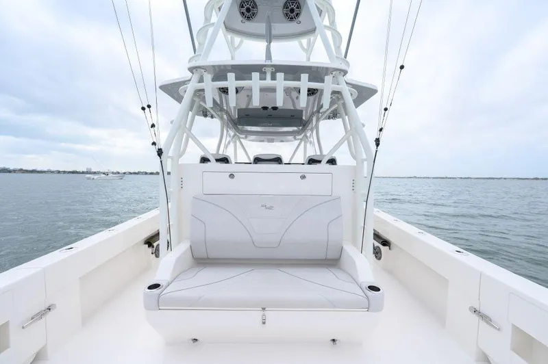 Slide: The Image of 2023 SeaVee 420Z boat with sleek seating and tower on open water. - 11