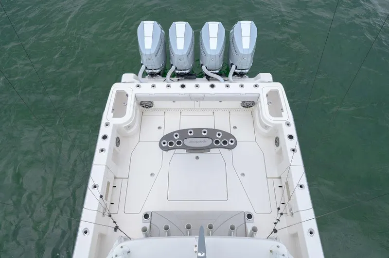 Slide: The Image of 2023 SeaVee 420Z boat with four powerful outboard engines on open water. - 15