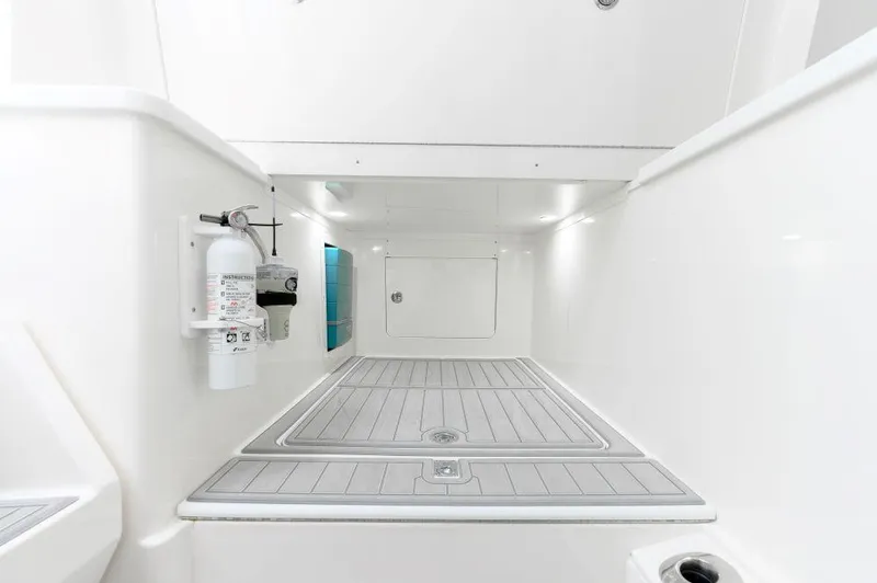 Slide: The Image of 2023 SeaVee 420Z interior with sleek white design and safety equipment. - 20