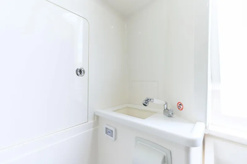 Slide: The Image of 2023 SeaVee 420Z boat interior with sink and storage compartment. - 21