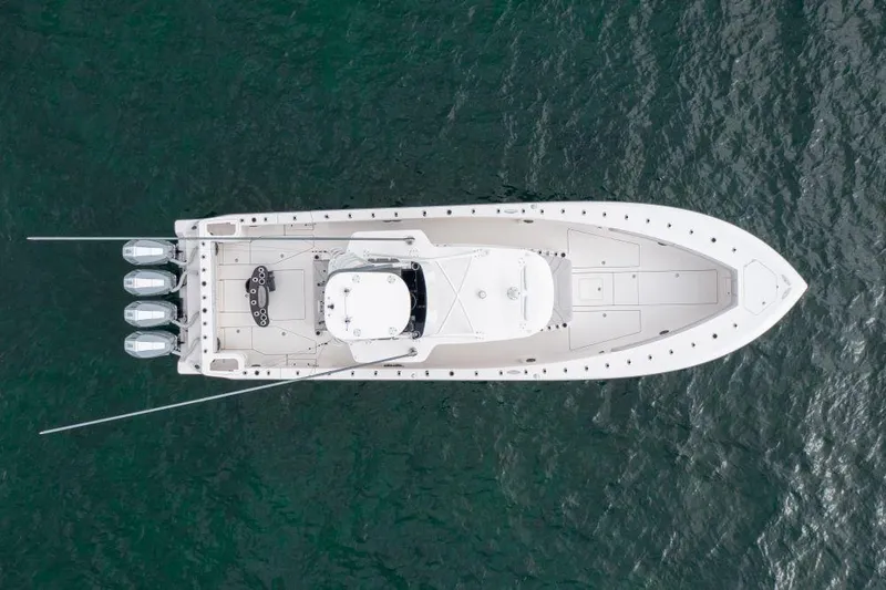 Slide: The Image of Aerial view of 2023 SeaVee 420Z boat on water, showcasing sleek design and multiple engines. - 5