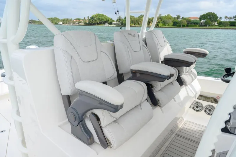 Slide: The Image of Luxurious seating on 2023 SeaVee 420Z boat with scenic water backdrop. - 9