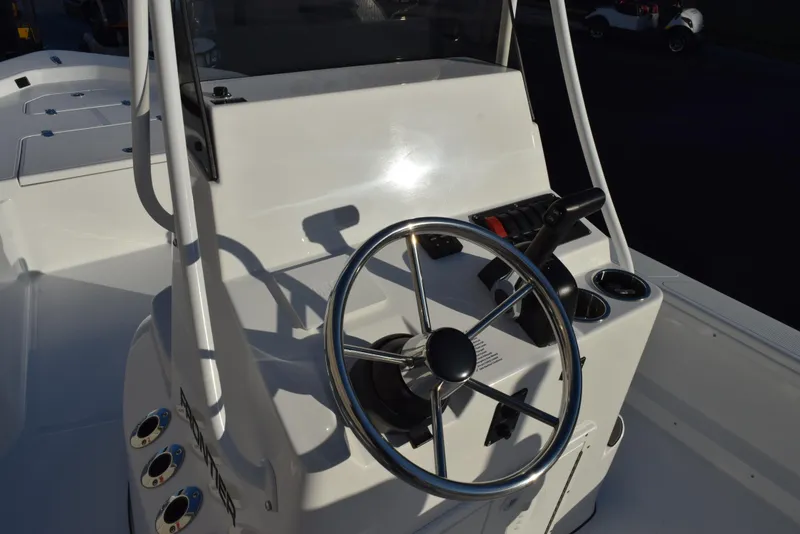 Slide: The Image of Steering console of 2025 Frontier 2104 boat with modern controls. - 10