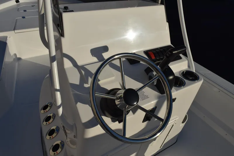 Slide: The Image of Steering console of 2025 Frontier 2104 boat with modern controls and gauges. - 20