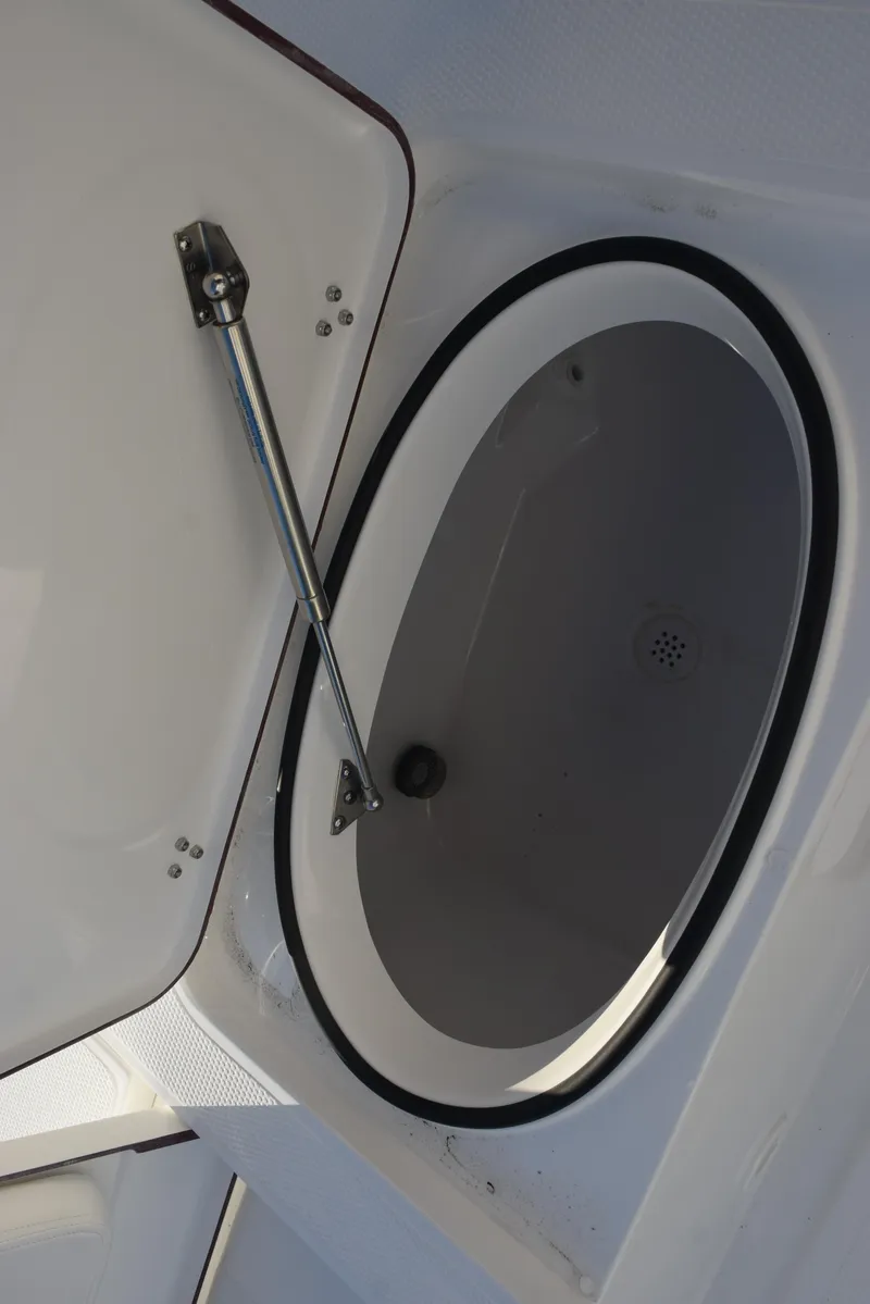 Slide: The Image of Open storage compartment in 2025 Frontier 2104 boat. - 23