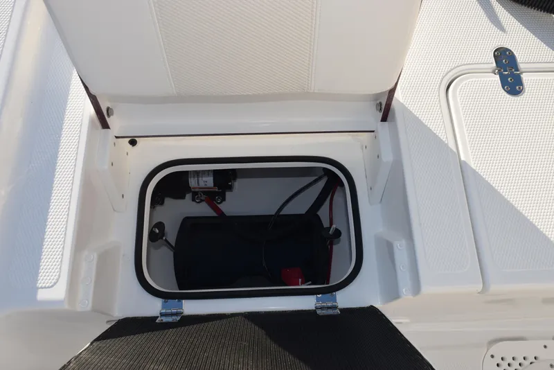 Slide: The Image of Open storage compartment in 2025 Frontier 2104 boat. - 25