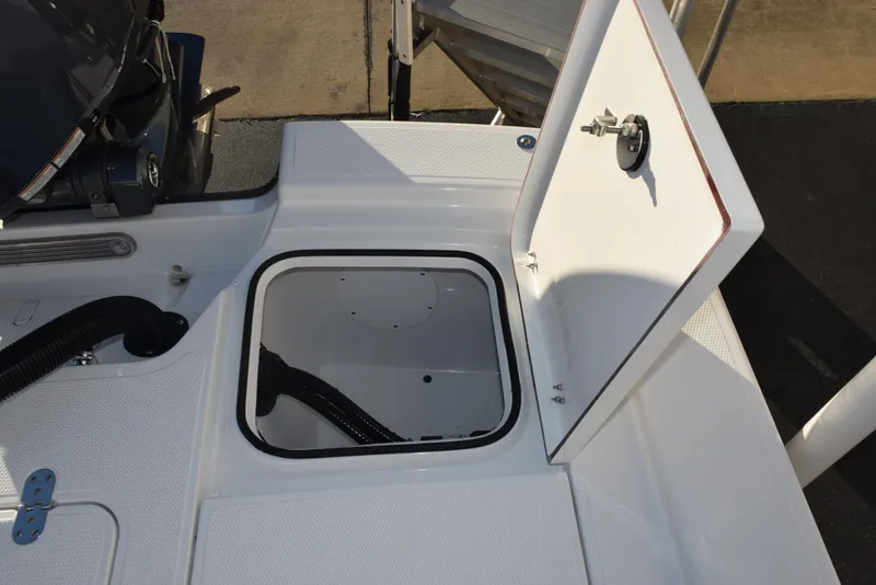 Slide: The Image of Open storage compartment on 2025 Frontier 2104 boat deck. - 27