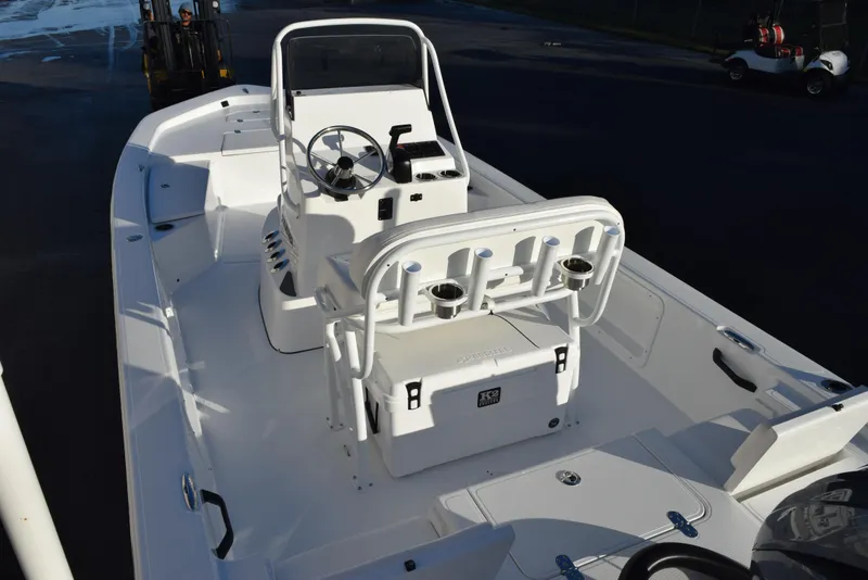Slide: The Image of 2025 Frontier 2104 boat interior with steering console and seating. - 7