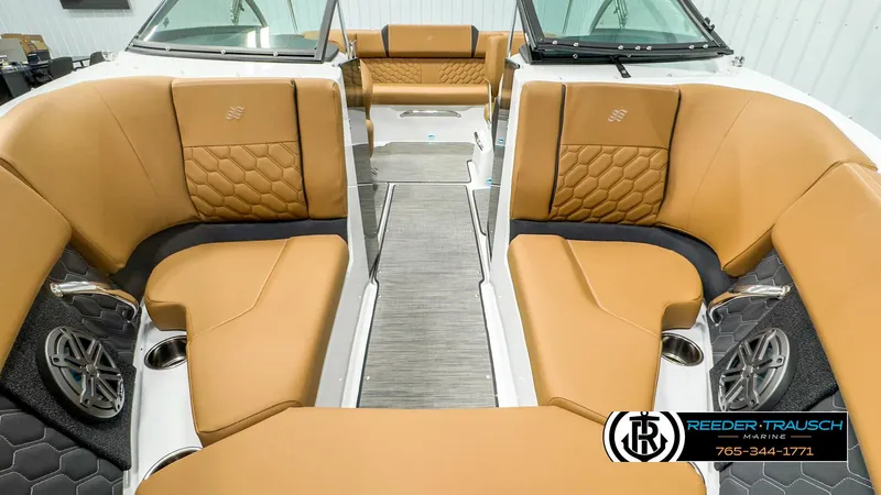 Slide: The Image of 2025 Four Winns H2 boat interior with tan leather seating and modern design. - 17