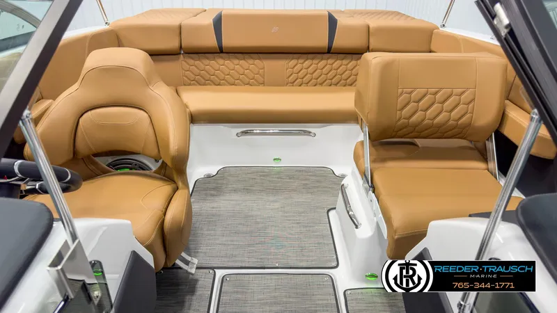 Slide: The Image of 2025 Four Winns H2 boat interior with tan leather seating and modern design. - 18