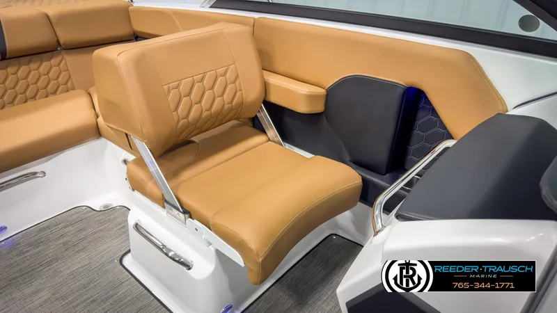 Slide: The Image of 2025 Four Winns H2 boat interior with tan leather seating and modern design. - 22