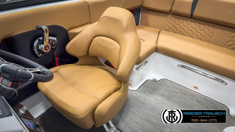 Slide: The Image of Luxurious interior of 2025 Four Winns H2 boat with tan seating and modern controls. - 24