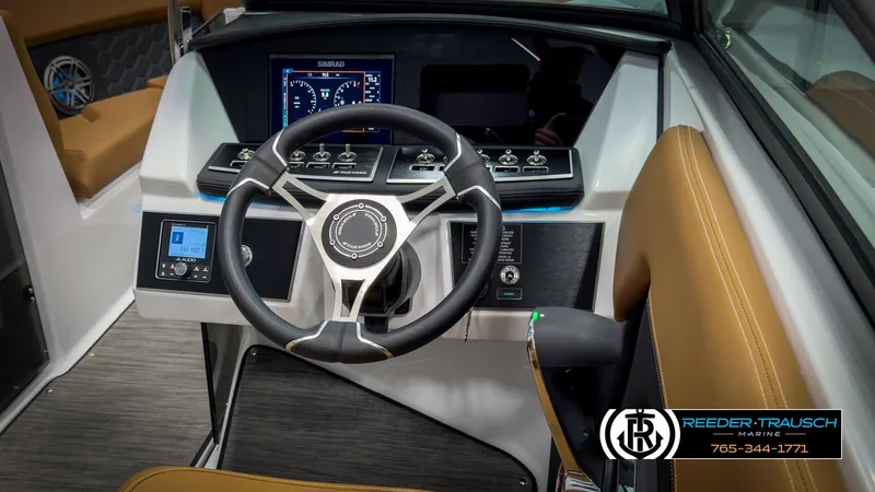 Slide: The Image of 2025 Four Winns H2 boat dashboard with steering wheel and control panel. - 33