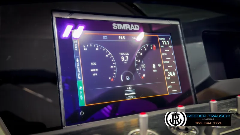 Slide: The Image of Simrad display on 2025 Four Winns H2 boat dashboard, showing speed and fuel data. - 37