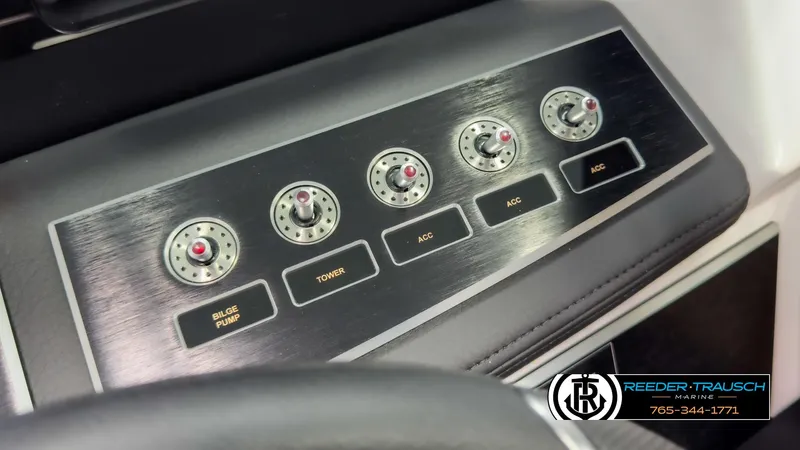 Slide: The Image of Control panel of 2025 Four Winns H2 boat with labeled switches. - 39
