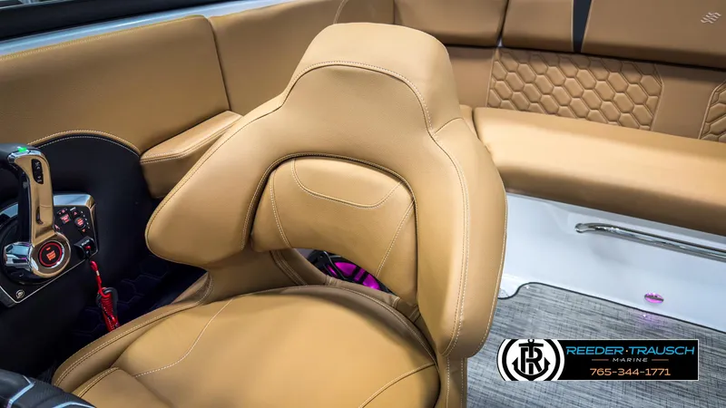 Slide: The Image of 2025 Four Winns H2 boat interior with tan leather seating and modern controls. - 42