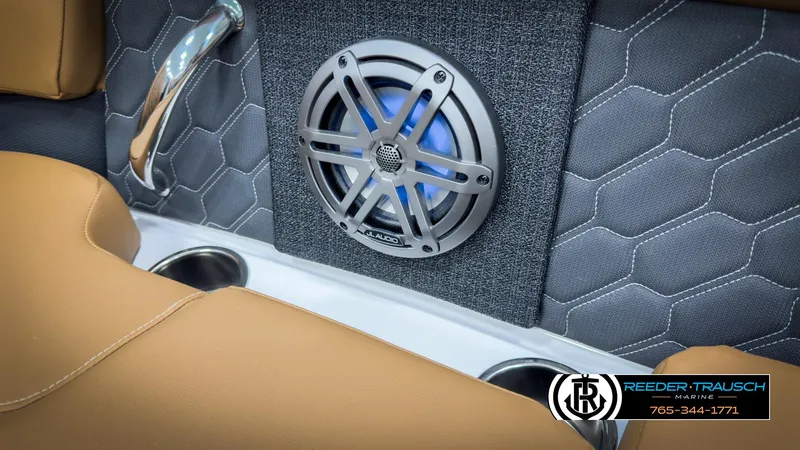 Slide: The Image of 2025 Four Winns H2 boat interior with JL Audio speaker and cup holders. - 47