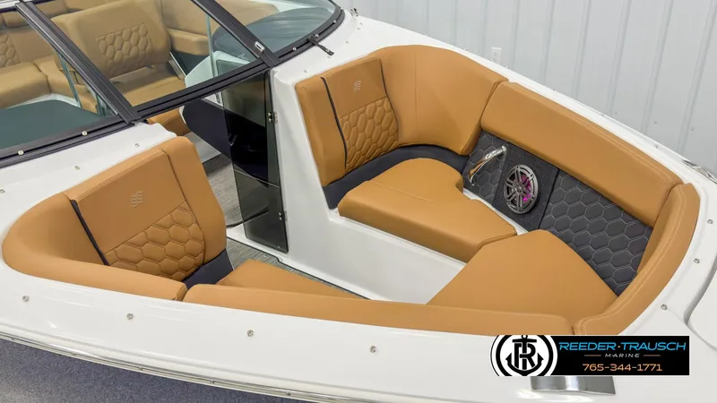 Slide: The Image of 2025 Four Winns H2 boat interior with tan leather seating and hexagonal stitching. - 9