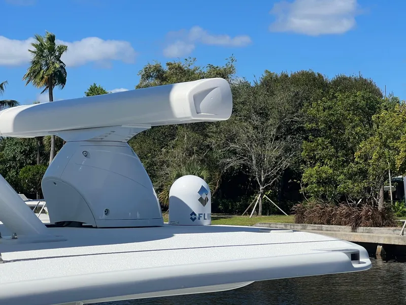 Slide: The Image of Radar equipment on 2017 Yellowfin 39 boat against a lush, green backdrop. - 6