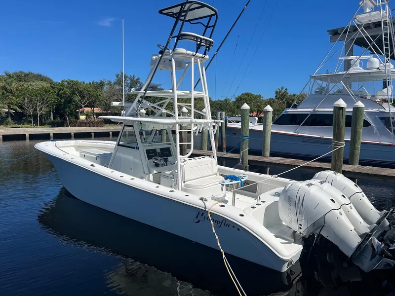 Slide: The Image of 2017 Yellowfin 39 boat docked in marina, clear blue sky. - 8