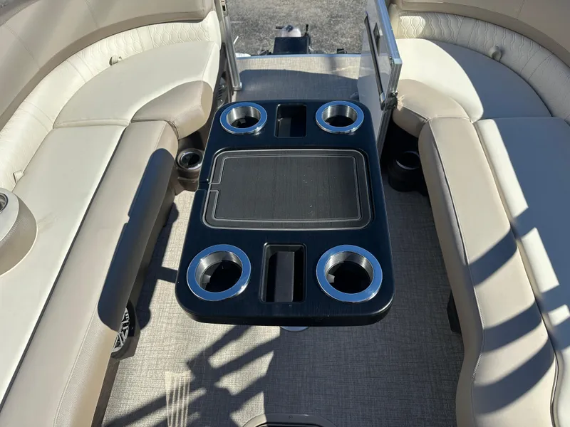 Slide: The Image of 2025 Avalon Catalina Cruise Funship interior with seating and cup holders. - 15