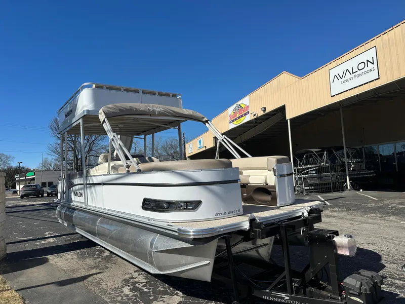 Slide: The Image of 2025 Avalon Catalina Cruise Funship 27' pontoon boat outside dealership. - 2