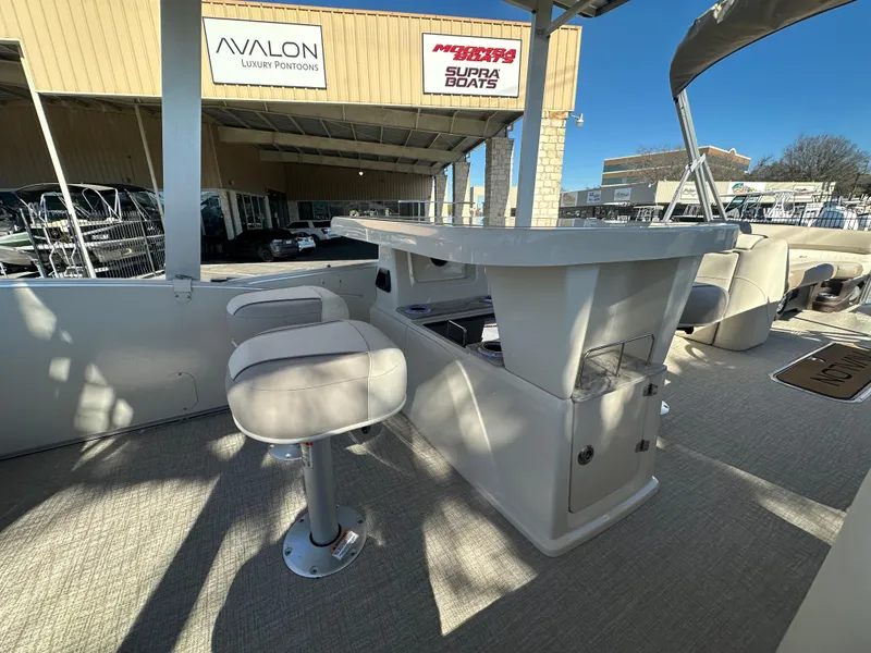 Slide: The Image of 2025 Avalon Catalina Cruise Funship interior with bar stools and counter. - 23