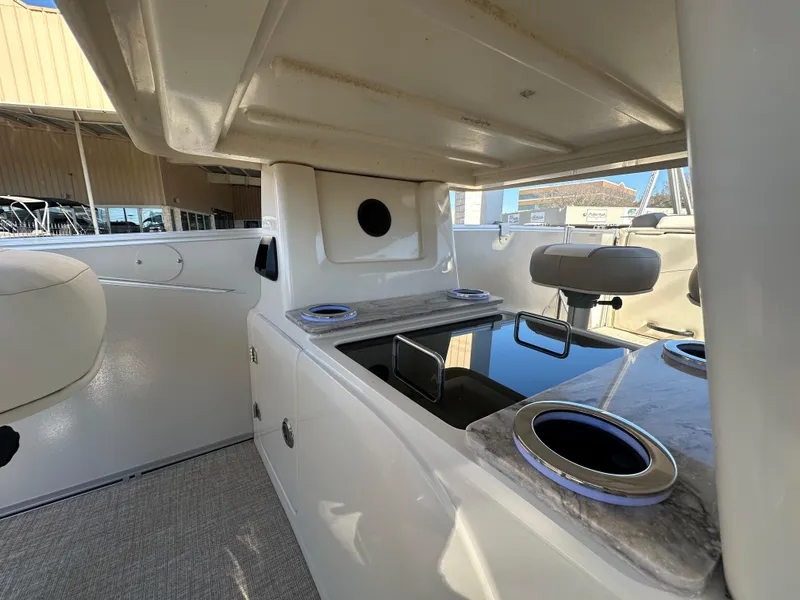 Slide: The Image of 2025 Avalon Catalina Cruise Funship interior with seating and cup holders. - 24