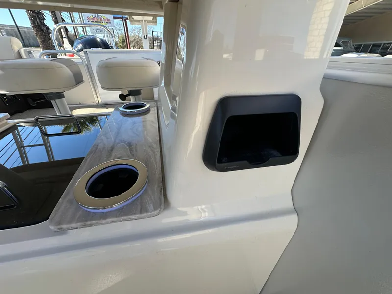 Slide: The Image of 2025 Avalon Catalina Cruise Funship interior with cup holders and seating area. - 25