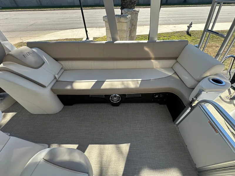 Slide: The Image of Luxurious seating on 2025 Avalon Catalina Cruise Funship, featuring beige upholstery and cup holder. - 32