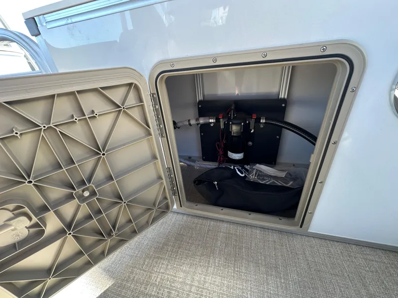 Slide: The Image of Open storage compartment on 2025 Avalon Catalina Cruise Funship boat. - 34