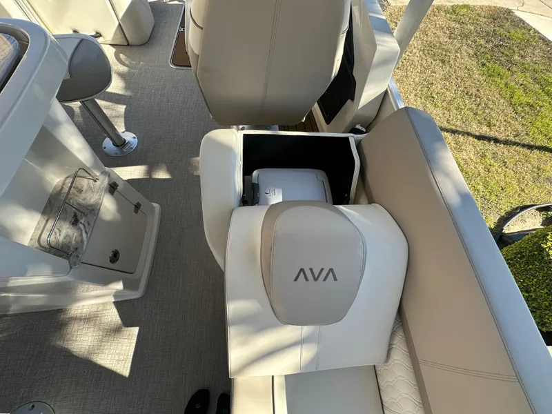 Slide: The Image of 2025 Avalon Catalina Cruise Funship interior with beige seating and storage compartment. - 36