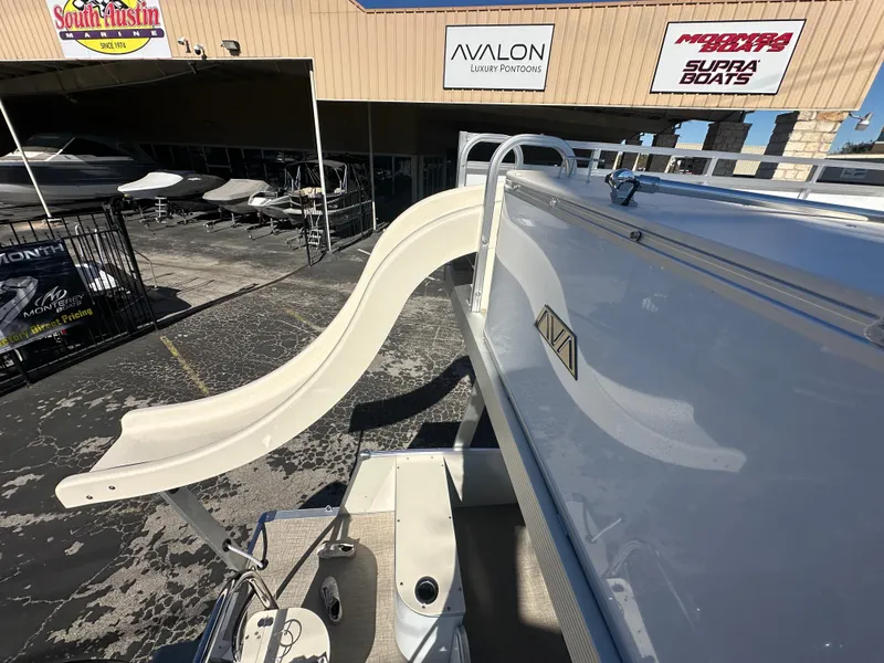 Slide: The Image of 2025 Avalon Catalina Cruise Funship with slide at a boat dealership. - 41