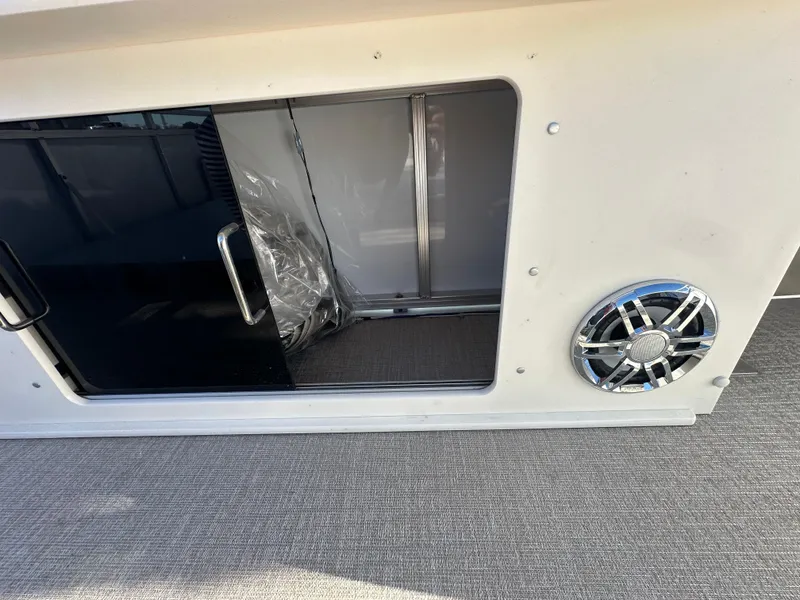 Slide: The Image of 2025 Avalon Catalina Cruise Funship interior with speaker and storage compartment. - 48