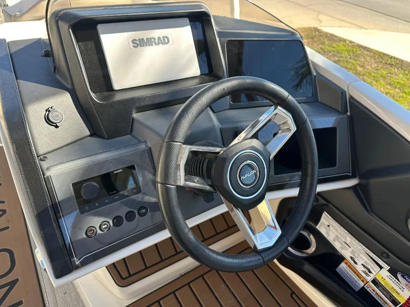 Slide: The Image of Steering console of 2025 Avalon Catalina Cruise Funship, featuring Simrad navigation system. - 50