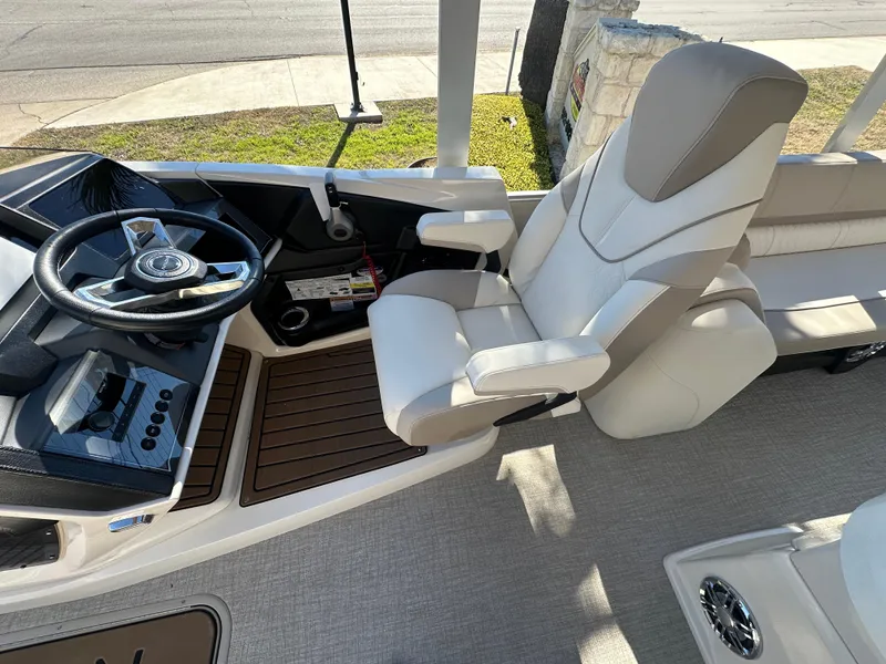 Slide: The Image of 2025 Avalon Catalina Cruise Funship interior with captain's chair and steering console. - 51
