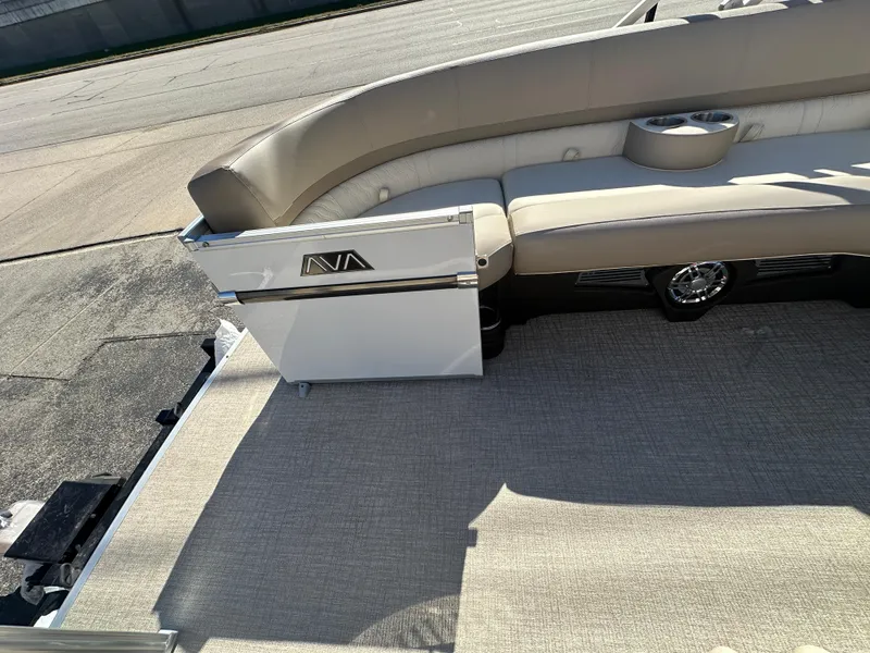 Slide: The Image of 2025 Avalon Catalina Cruise Funship interior with beige seating and carpet flooring. - 9