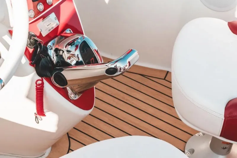 Slide: The Image of Boat interior with red and white seats, chrome controls, and wooden flooring. - 21