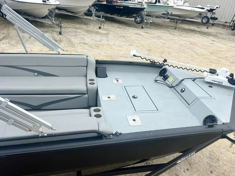 Slide: The Image of 2024 SeaArk BIG EASY 24 boat with spacious seating and modern design. - 3