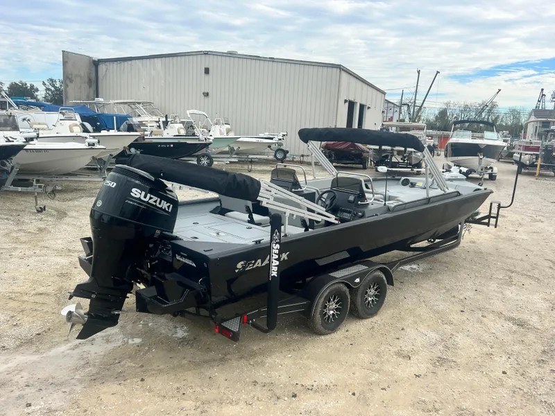 Slide: The Image of 2024 SeaArk BIG EASY 24 boat with Suzuki engine in a boatyard. - 5