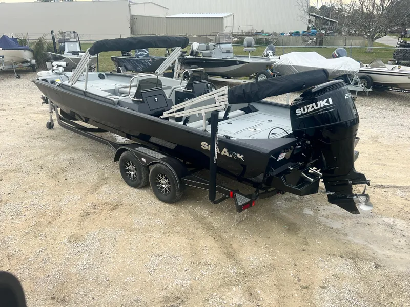 Slide: The Image of 2024 SeaArk BIG EASY 24 boat with Suzuki engine on trailer. - 7