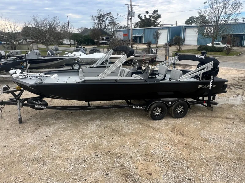 Slide: The Image of 2024 SeaArk BIG EASY 24 boat on trailer, parked outdoors. - 8